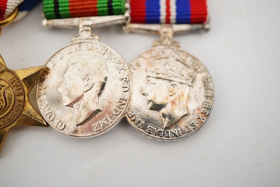 A First World War George V Bravery in the field medal awarded to CPL. R.E. Cox 11th Royal Sussex, a Second World War trio and miniatures, a Masonic medal, etc. (11). Condition - fair to good.